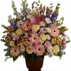 Classic pastel sympathy basket made of Larkspur, Roses, Gerbera Daisies, Alstromeria and