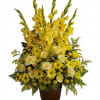 Classic yellow sympathy basket made of Glads, Roses, Daisies and fillers.