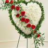 Red and white heart made with Carnations and Roses.