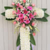 Deluxe standing cross made with pom poms,roses &amp; lilies.