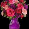 Passionately pink! This arrangement boasts hot pink roses and dark red spray