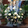 Beautiful navy blue and white roses, delphinium, daises, carnations and other fillers