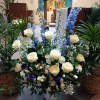 Beautiful navy blue and white roses, delphinium, daises, carnations and other fillers