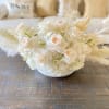 This design is a lovely combination of soft preserved flowers, white hydrangeas
