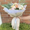 Beautiful peach and light pink blooms with the perfect amount of greens