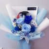 blue and light blue preserved roses with filler wrapped in blue tone
