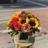 A beautiful sunflower and rose arrangement. The perfect gift to brighten up
