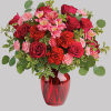 Tres belle! Ruby red roses and delicate pink alstroemeria are mixed with