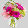 The Blooming Bliss arrangement showcases blushing blooms and definitive style to send
