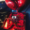 Large floral box with LOVE spelled out in roses, spray roses, and