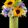 Bright yellow sunflowers, blue iris, white daisies, combined with yellow solidago, green
