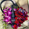 Large black heart ox designed with roses, orchids, and a bottle of