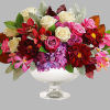 A chic spin on the traditional fall arrangement, this luxurious bouquet of