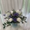 Blue and white arrangement in a reusable blue ceramic pitcher. 