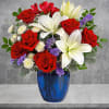 Revel in the crisp, classic color scheme of white lilies and radiant