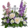 Soft and serene, this artistic array of cream and lavender blooms around