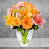 The Brighten Your Day Arrangement is blooming with brilliant color and cheer