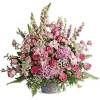 Full of grace and light, this majestic bouquet of pink blooms and