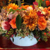 Beautiful autumn arrangement of roses, dahlias, orchids and berries