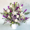 A tall and one sided arrangement designed for a funeral or memorial