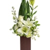 Send peace and serenity with this stylish arrangement of white roses, luxurious