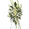 An elegant expression of sympathy, this wondrous white and green spray conveys