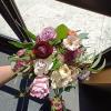 Beautiful mix of blush, peach, purple and burgundy roses, scabiosa, butterfly and