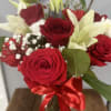 This pretty design of roses and lilys will surely make someone smile