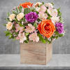 Chic meets sweet. This beautiful arrangement flaunts fresh spring style, gathered with