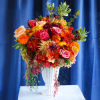 The Russet Leaves Arrangement is the quitessential classic autumn arrangement. Bursting with