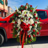 All red Large Sympathy standing Spray 
Includes all red roses and white