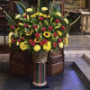 The everlasting beauty of a traditional flower basket is evoked with this