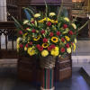 The everlasting beauty of a traditional flower basket is evoked with this