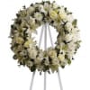 Classic White Wreath is composed of a variety of seasonal white flowers.