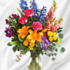 A rainbow of beauty for any occasion. Purple hydrangea, pink roses, and