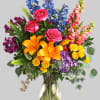 A rainbow of beauty for any occasion. Purple hydrangea, pink roses, and
