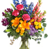 A rainbow of beauty for any occasion. Purple hydrangea, pink roses, and