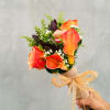 A stunning autumn-themed bridal or bridesmaid bouquet featuring Calla Lilies, safari, roses