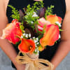 A stunning autumn-themed bridal or bridesmaid bouquet featuring Calla Lilies, safari, roses