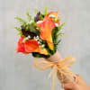 A stunning autumn-themed bridal or bridesmaid bouquet featuring Calla Lilies, safari, roses