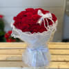 
A stunning bouquet of 24 red roses wrapped in pearl-lined wrapping paper.