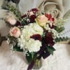 Combination of roses, hydrangeas, alstroemerias and more, creating a luxurious arrangement to