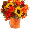 Greet the new season with this heartwarming sunflower and rose bouquet, presented