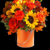 Greet the new season with this heartwarming sunflower and rose bouquet, presented