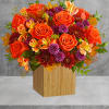 Radiant roses and lush fall blooms are presented to perfection in a