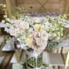 This angelic arrangement is as cute as it is pretty. Featuring the