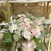 This angelic arrangement is as cute as it is pretty. Featuring the