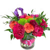 Pink, and orange roses come together with green hydrangea for a bright