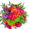 Pink, and orange roses come together with green hydrangea for a bright