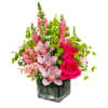 Escape to paradise with this lush and vibrant flower arrangement.  This